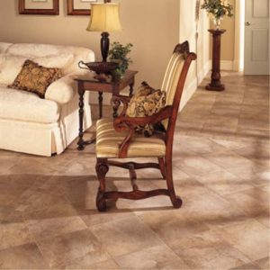 This beautiful travertine-like floor is created using a durable ceramic tile. Portenza tile comes in a variety of colors and sizes. The picture shows the light brown/tan color with a pattern made from the field tile and some smaller matching decorative tiles.